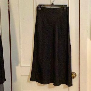 Women’s Goldie London long black satin like skirt with slit size medium